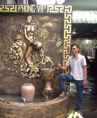 phù điêu cô gái ôm lu nước